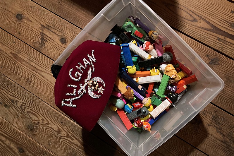 Washington Post staff writer Jura Koncius has spent the pandemic decluttering the attic of her 1937 Colonial, where the family stores excess stuff, including their Pez and fez collections. (The Washington Post/Jura Koncius)