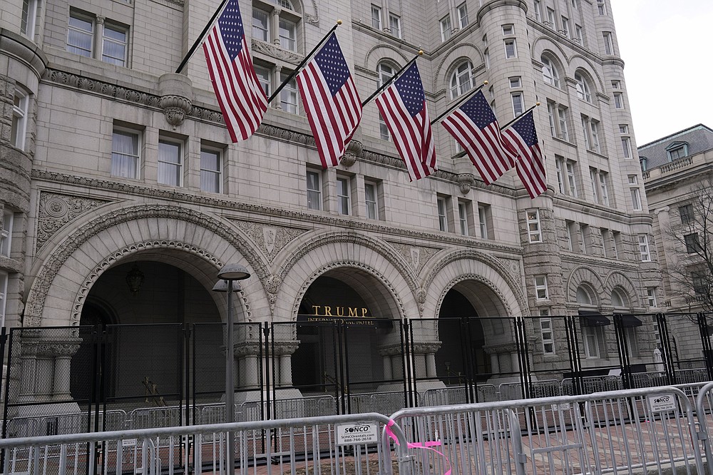 Extra security barricades are outside the Trump Hotel in Washington, Friday, Jan. 15, 2021, ahead of the inauguration of President-elect Joe Biden and Vice President-elect Kamala Harris. (AP Photo/Susan Walsh)