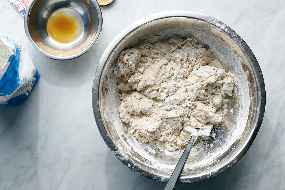 Mixing and kneading bagel dough (The New York Times/David Malosh)