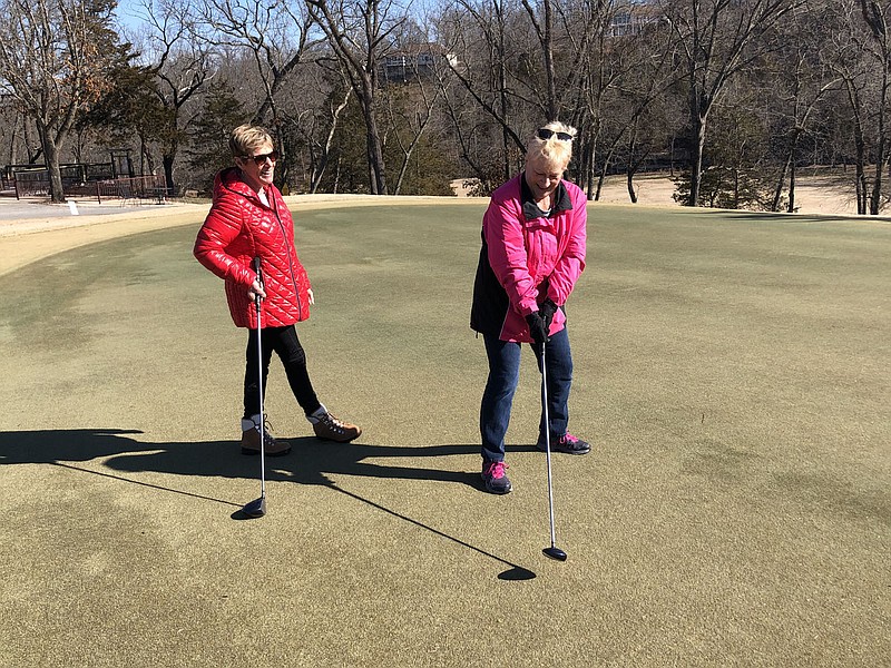 Rick Harvey/Special to The Weekly Vista
Mary Henning, left, and Kaye Pedziwater, facilitators of the 100-plus member Putt Savers golf group, share a laugh while talking about their group last week at Scotsdale Golf Course.