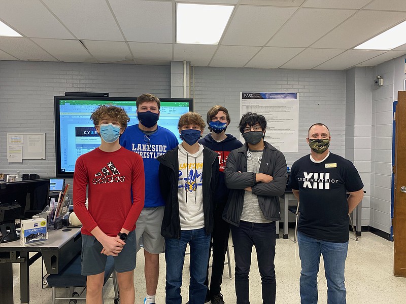 The Lakeside EAST team recently participated in the CyberPatriot competition and reached platinum team status. From left are ninth-grader Wesley Kleinman, 11th-graders Easton Russell, Evan Meyers, Ben Willard and Adrian Arias, and John Stokes, EAST coach. Not pictured is senior Ethan Meir. - Photo by John Anderson of The Sentinel-Record