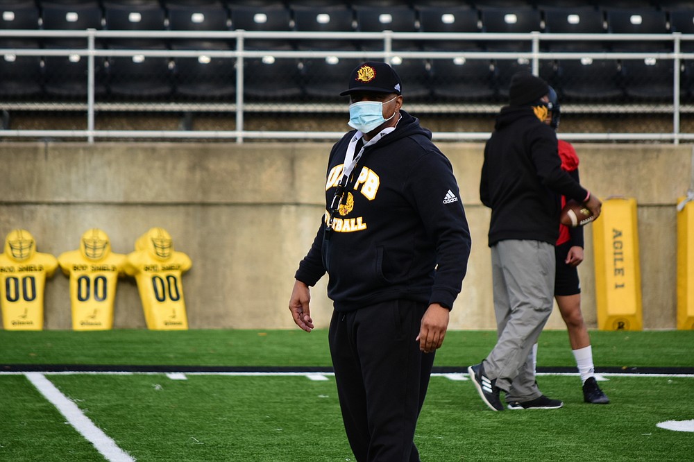UAPB Coach Doc Gamble observes warm-up drills before the start of preseason camp Friday, Jan. 29, 2021, at Simmons Bank Field in Pine Bluff. (Pine Bluff Commercial/I.C. Murrell)
