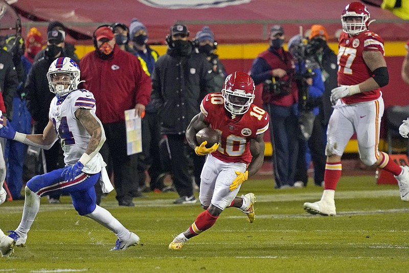 Kansas City Chiefs wide receiver Tyreek Hill (10) runs up field after catching a pass during the second half of the AFC championship NFL football game against the Buffalo Bills, Sunday, Jan. 24, 2021, in Kansas City, Mo. (AP Photo/Jeff Roberson)