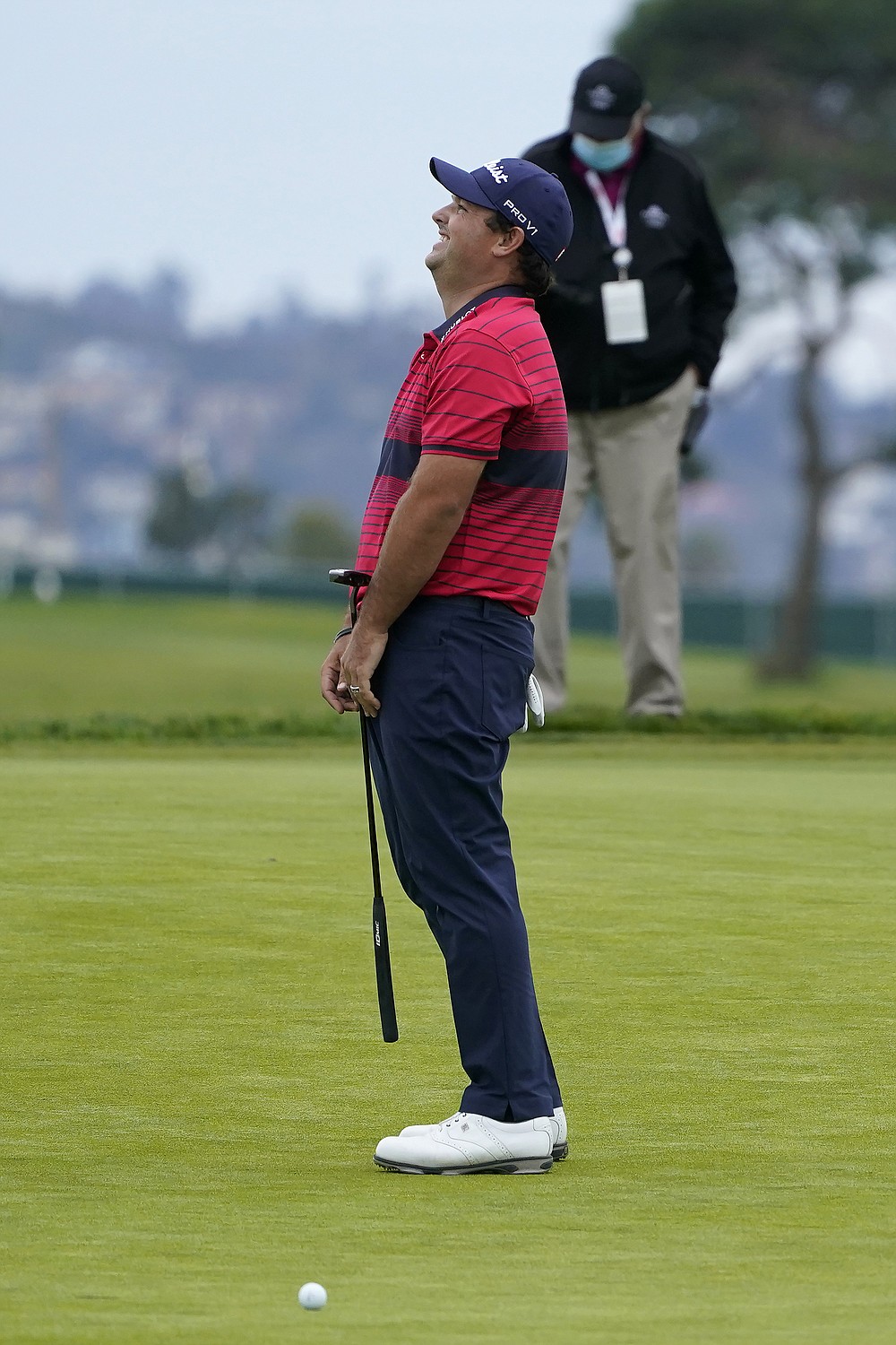 Patrick Reed reacts after missing a putt on the 16th hole on the South Course during the final round of the Farmers Insurance Open golf tournament at Torrey Pines, Sunday, Jan. 31, 2021, in San Diego. (AP Photo/Gregory Bull)