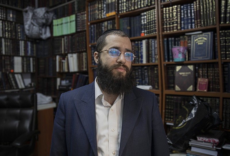 Rabbi Chaim Kanievsky’s grandson Yaakov Kanievsky, whose dominant role in the life of his influential grandfather has led to questions, at the Rabbi’s home in Bnei Brak, Israel, Jan. 24, 2021. Kanievsky denies that he exercises any undue influence over his grandfather’s pronouncements. (Dan Balilty/The New York Times)