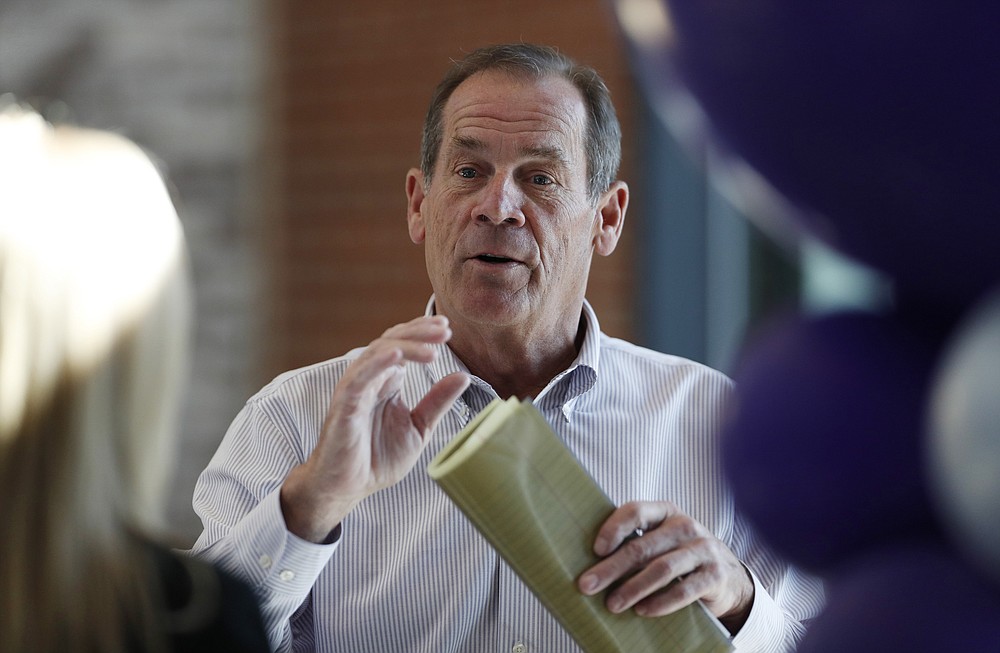 FILE - Dick Monfort, co-owner of the Colorado Rockies, talks during a media tour of Coors Field as workers prepare for the baseball team's home-opener against the Los Angeles Dodgers, in this file photograph taken Thursday, April 4, 2019, in Denver. Monfort and team general manager Jeff Bridich will hold a news conference Tuesday, Feb. 2, 2021, to discuss the trade of the team's star third baseman, Nolan Arenado, to the St. Louis Cardinals. (AP Photo/David Zalubowski, File)