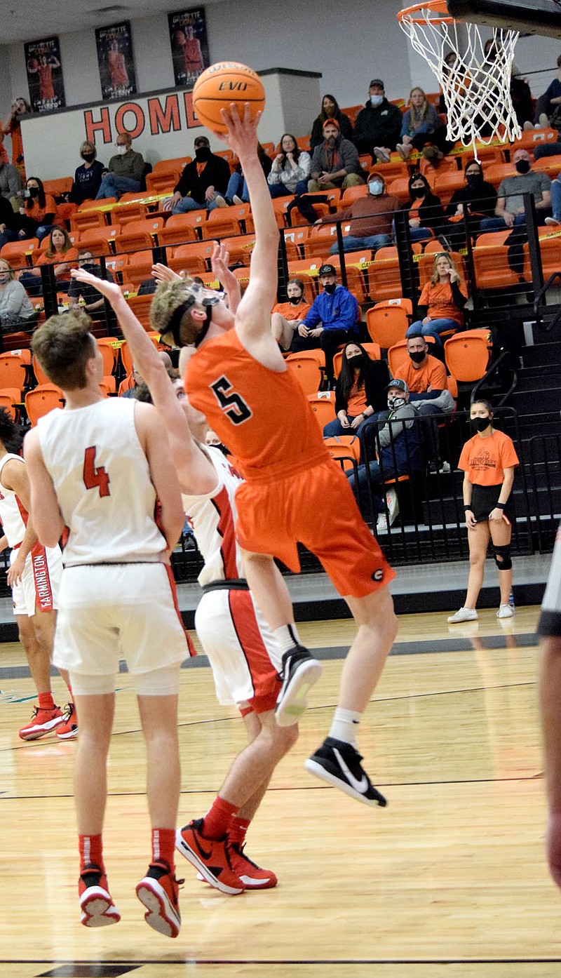 Westside Eagle Observer/MIKE ECKELS
Michael Duke (Gravette 5) puts up a jumper late in the third quarter of the Gravette-Farmington conference game at Lion Arena in Gravette Friday night. Farmington  took the conference win 64-51 over Gravette.