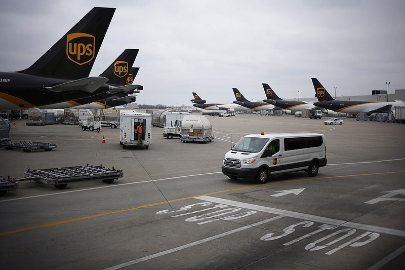 Cargo planes sit parked on the tarmac at a United Parcel Service Worldport facility in Louisville, Ky., on Jan. 28, 2020. MUST CREDIT: Bloomberg photo by Luke Sharrett.