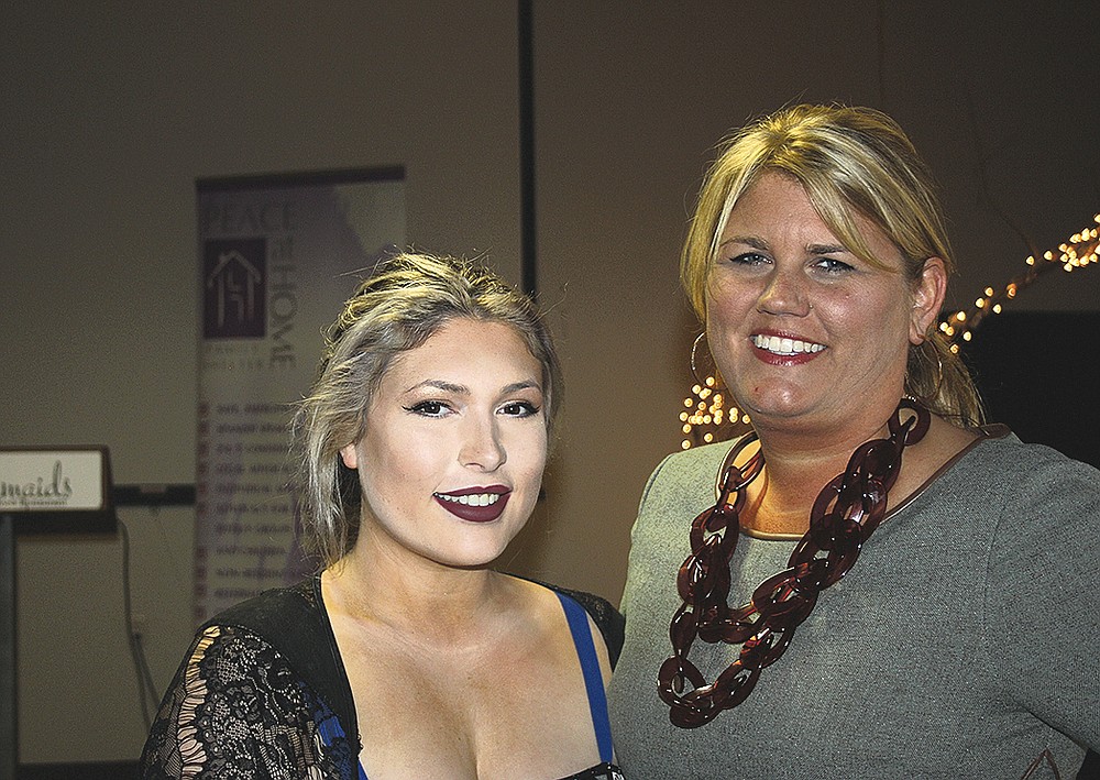NWA Democrat-Gazette/CARIN SCHOPPMEYER Clancy Walker (left) and Mandy Macke help support Peace at Home at the Courage Award Luncheon on Oct. 23 at Mermaids Seafood Restaurant in Fayetteville.