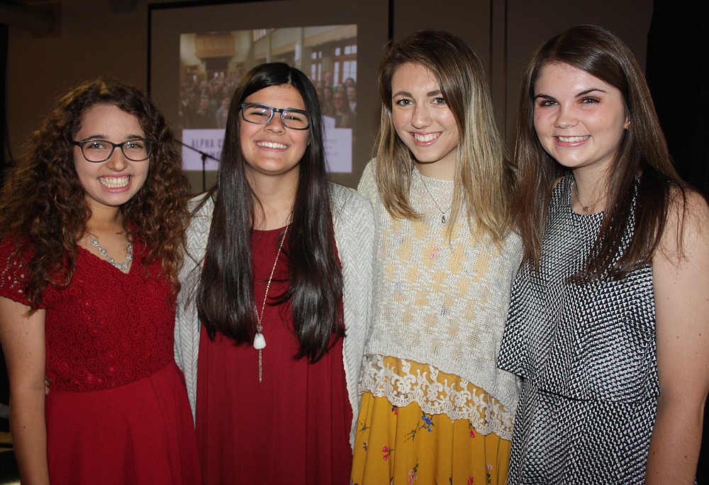 NWA Democrat-Gazette/CARIN SCHOPPMEYER Kianna Sarvestani (from left), Josie Bates, Julia Baird and Brooke Swilley, represent Courage Award honoree, Alpha Chi Omega, Delta Rho Chapter, at the Peace at Home benefit.
