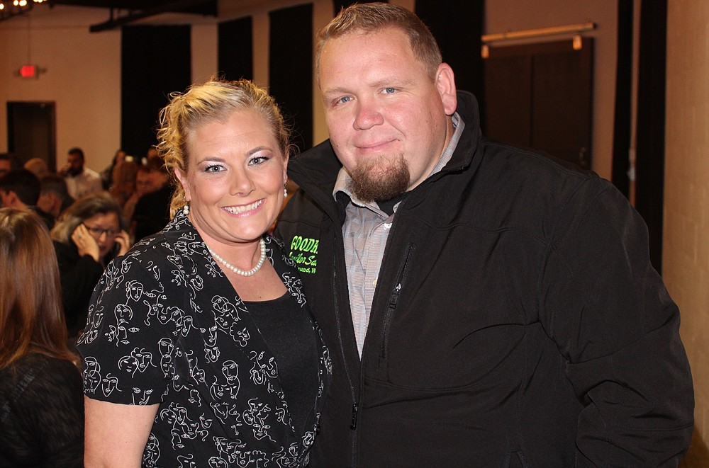 NWA Democrat-Gazette/CARIN SCHOPPMEYER Sarah and Josh Marchant enjoy the Courage Awards luncheon where Sarah was the featured speaker Oct. 25 at Mermaids Seafood Restaurant in Fayetteville.