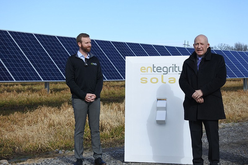 Alma Mayor Jerry Martin, right, speaks while Sam Selig, director of operations for project development at the Little Rock-based company Entegrity, listens during a “Flip the Switch Event” for Alma’s new solar array at its wastewater treatment facility at 2500 Orrick Rd. Friday. This new array comprises the first phase of a 25-year solar services agreement between the city of Alma and Entegrity.
(NWA Democrat-Gazette/Thomas Saccente)