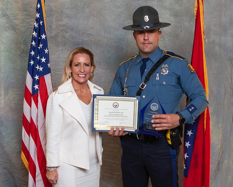 Arkansas Attorney General Leslie Rutledge, left, presents Arkansas State Police Cpl. Andrew Ault with the Garland County Outstanding Law Enforcement Officer of the Year Award during the 2020 Officer of the Year Luncheon in Benton on Jan. 29. - Submitted photo