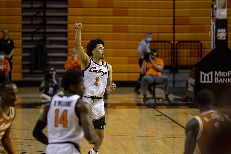 Oklahoma State guard Cade Cunningham (2) celebrates after making a basket in the second overtime of the NCAA college basketball game against Texas in Stillwater, Okla., Saturday, Feb. 6, 2021. (AP Photo/Mitch Alcala)