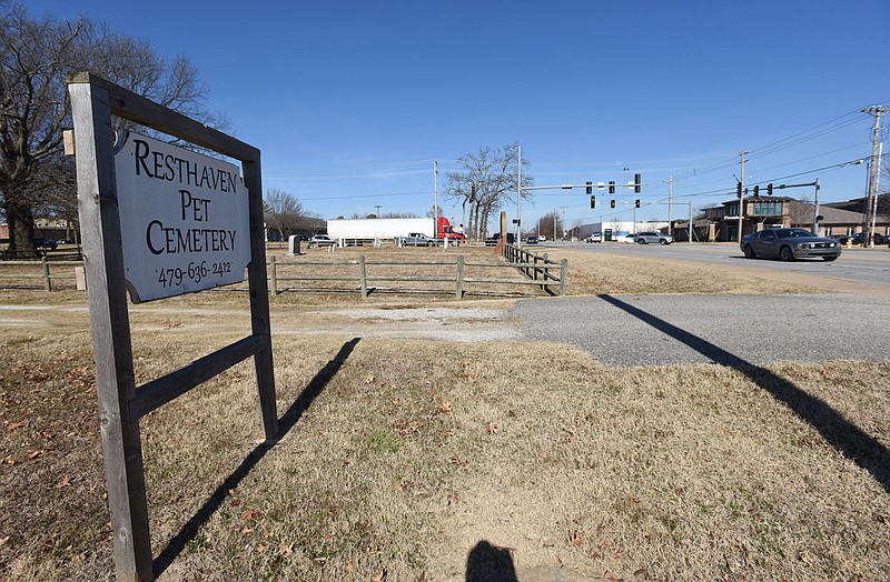 Traffic moves Wednesday Feb. 3 2021 through the intersection of Southeast J and Southeast 28th street in Bentonville near Resthaven Pet Cemetery.
(NWA Democrat-Gazette/Flip Putthoff)
