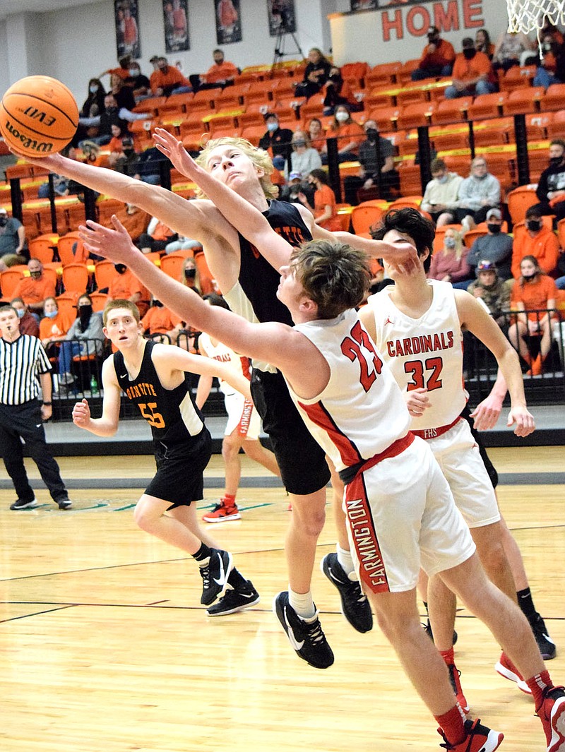 Westside Eagle Observer/MIKE ECKELS
Rhett Hilger (Gravette 12) steals the ball away from a Cardinal players during the second quarter of the Gravette-Farmington Junior Varsity basketball game in Gravette Friday night. Hilger led the junior varsity with nine points in the team's final basketball contest of the 20-21 season.