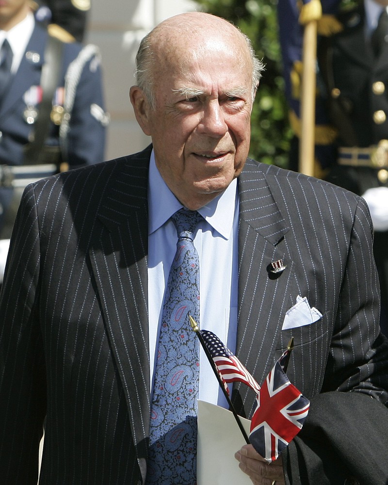 FILE - In this May 7, 2007 file photo, former Secretary of State George Schultz arrives to watch Queen Elizabeth II take part in arrival ceremonies on the South Lawn of the White House in Washington.  Shultz, former President Ronald Reagan’s longtime secretary of state, who spent most of the 1980s trying to improve relations with the Soviet Union and forging a course for peace in the Middle East, died Saturday, Feb. 6, 2021. He was 100. (AP Photo/Ron Edmonds, File)