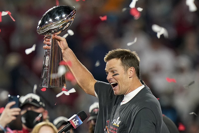 Tampa Bay Buccaneers quarterback Tom Brady celebrates with the Vince Lombardi Trophy after the NFL Super Bowl 55 football game against the Kansas City Chiefs Sunday, Feb. 7, 2021, in Tampa, Fla. The Buccaneers defeated the Chiefs 31-9 to win the Super Bowl. (AP Photo/Lynne Sladky)