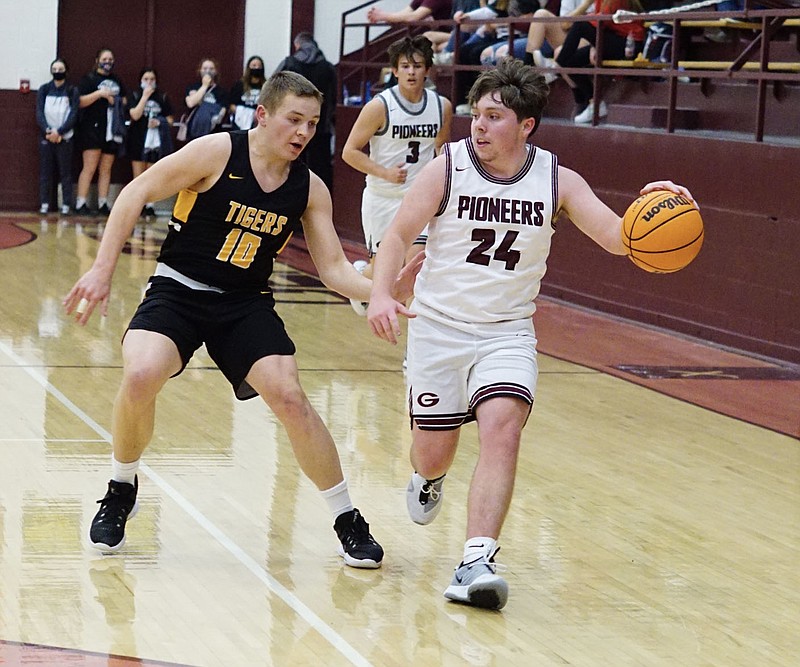 Westside Eagle Observer/RANDY MOLL
Andrew Godfrey of Gentry brings the ball down the court during play again the visiting Tigers from Prairie Grove on Tuesday, Feb. 2, 2021.