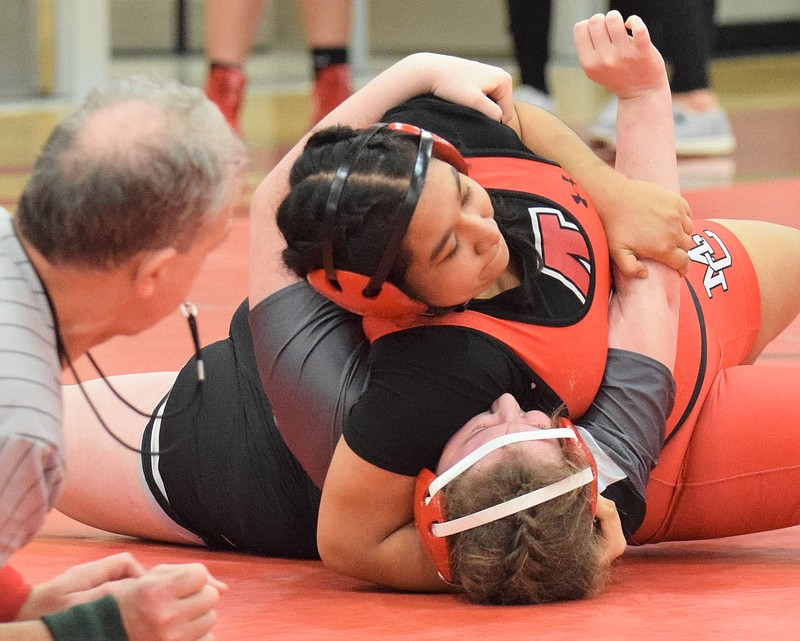RICK PECK/SPECIAL TO MCDONALD COUNTY PRESS McDonald County's Gisel Aragon pins Ellieahanna DeWitt of Willard on her way to a fourth place finish at the Missouri Class1 District 5 Girls Wrestling Tournament held on Feb. 5-6 at MCHS.