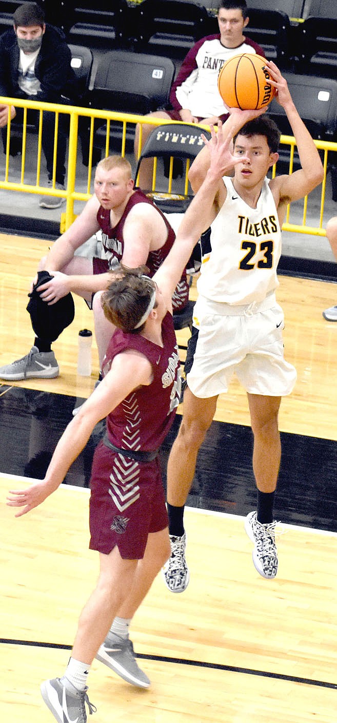MARK HUMPHREY ENTERPRISE-LEADER/Prairie Grove senior Sloan Smith elevates while launching a jump-shot from the corner in 3-point territory.