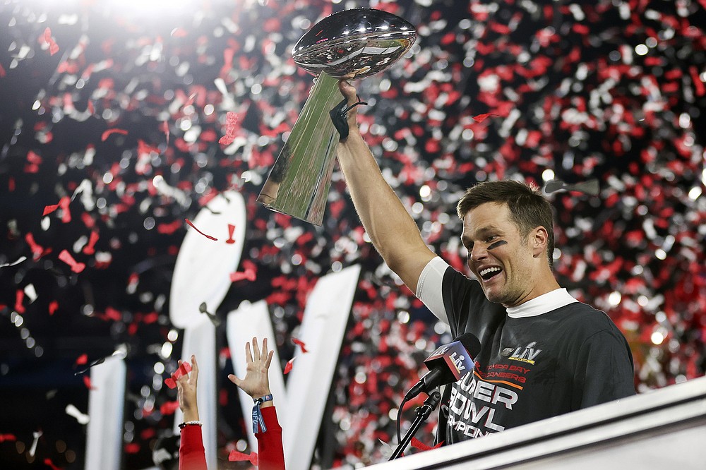 Tampa Bay Buccaneers quarterback Tom Brady (12) holds the Vince Lombardi trophy following the NFL Super Bowl 55 football game against the Kansas City Chiefs, Sunday, Feb. 7, 2021, in Tampa, Fla. Tampa Bay won 31-9. (Ben Liebenberg via AP)