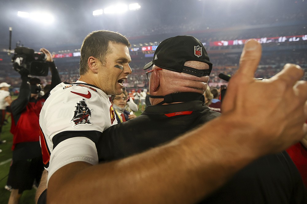 Tampa Bay Buccaneers quarterback Tom Brady (12) celebrates with head coach Bruce Arians following the NFL Super Bowl 55 football game against the Kansas City Chiefs, Sunday, Feb. 7, 2021 in Tampa, Fla. Tampa Bay won 31-9. (Ben Liebenberg via AP)
