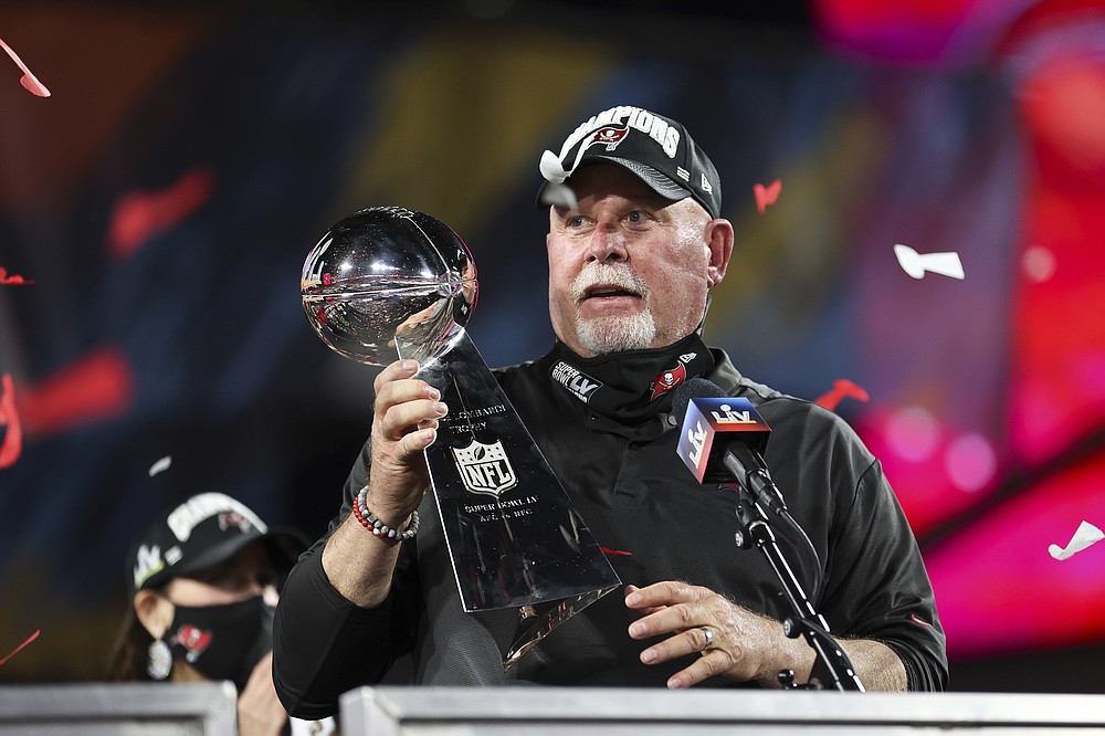 Tampa Bay Buccaneers head coach Bruce Arians holds the Vince Lombardi trophy following the NFL Super Bowl 55 football game against the Kansas City Chiefs, Sunday, Feb. 7, 2021 in Tampa, Fla. Tampa Bay won 31-9. (Ben Liebenberg via AP)