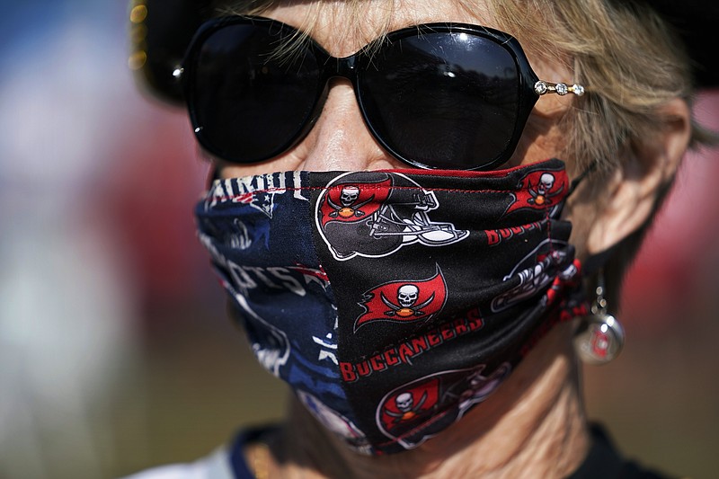 A Tampa Bay Buccaneers fans arrives before the NFL Super Bowl 55 football game between the Kansas City Chiefs and Tampa Bay Buccaneers, Sunday, Feb. 7, 2021, in Tampa, Fla. (AP Photo/Mark Humphrey)