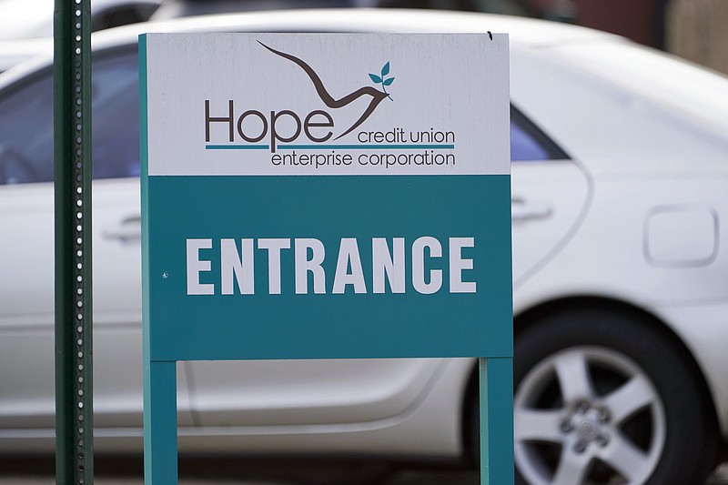 An entrance sign announces the corporate office of Hope Enterprise Corporation, which runs a Mississippi-based credit union in Jackson, Miss., Monday, Feb. 8, 2021. Hope Enterprise Corporation is partnering with seven cities and nine historically Black colleges and universities to launch the  “Deep South Economic Mobility Collaborative." Goldman Sachs 10,000 Small Businesses initiative is providing up to $130 million to the endeavor, which will be available to clients in Louisiana, Mississippi, Alabama, Arkansas and Tennessee. (AP Photo/Rogelio V. Solis)