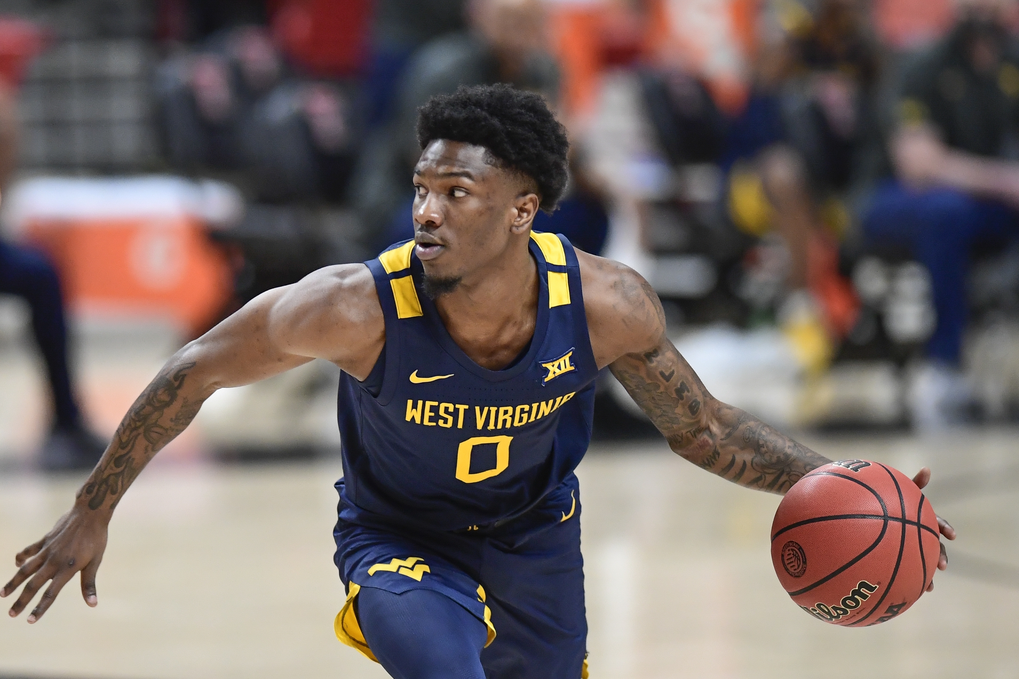 No. 14 West Virginia outlasts No. 7 Red Raiders