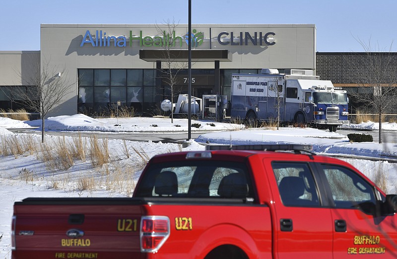 A Minneapolis Bomb Squad vehicle is parked near the entrance to the Allina Health Clinic Tuesday, Feb. 9, 2021, in Buffalo, Minn.  A 67-year-old Minnesota man who was unhappy with the care he'd received at area health centers in recent years opened fire at a clinic on Tuesday, wounding five patients, authorities said. (Dave Schwarz/St. Cloud Times via AP)