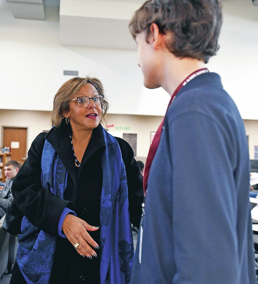 Kankakee High School freshman David Love talks to U.S. Rep. Robin Kelly after a visit to recognize his project that won the 2019 Congressional App Challenge for Illinois' 2nd Congressional District, Monday, Feb. 24, 2020 in Kankakee, Ill.. (Tiffany Blanchette/The Daily Journal via AP)