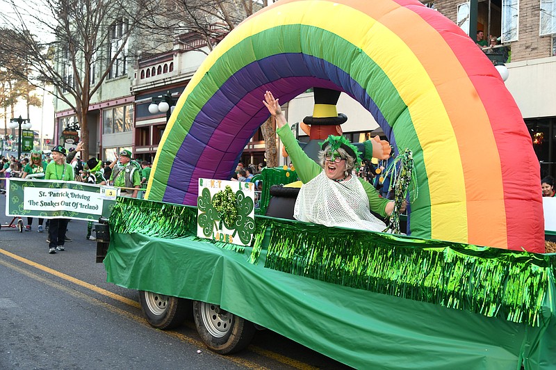 One of the Bucket List Ladies waves from a float during the First Ever 16th Annual World’s Shortest St. Patrick’s Day Parade on March 17, 2019. - File photo by The Sentinel-Record