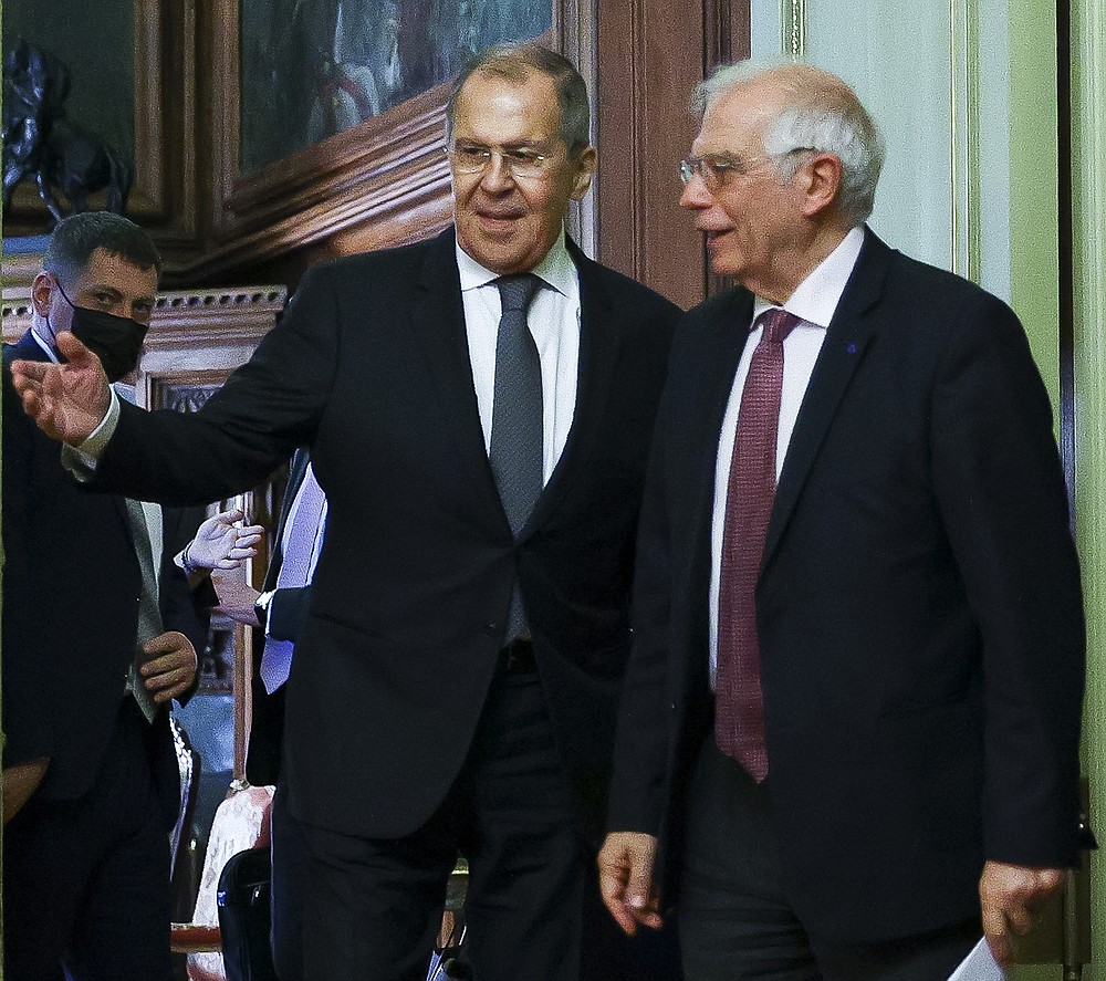 In this photo released by the Russian Foreign Ministry Press Service, Russian Foreign Minister Sergey Lavrov, left, welcomes High Representative of the EU for Foreign Affairs and Security Policy, Josep Borrell to attend a joint news conference following their talks in Moscow, Russia, Friday, Feb. 5, 2021. The European Union's top diplomat expressed hopes Friday that the COVID-19 vaccine developed by Russia will soon be used across the 27-nation bloc. During a visit to Moscow, EU foreign affairs chief Josep Borrell said the Sputnik V vaccine is "good news for the whole mankind." (Russian Foreign Ministry Press Service via AP)