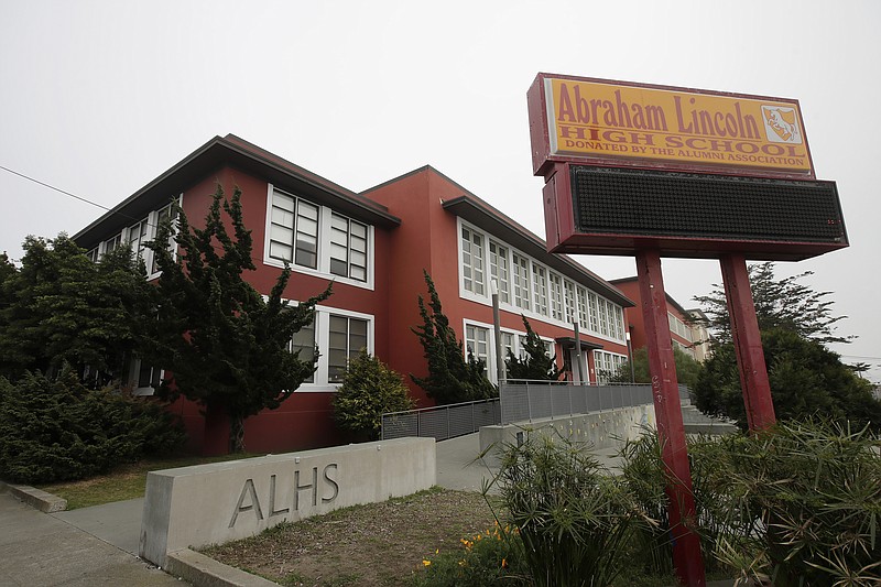 FILE - This March 12, 2020, file photo, shows the Abraham Lincoln High School in San Francisco. The number of suicidal children in San Francisco has hit a record high and health experts say it is clear that keeping public schools closed "is catalyzing a mental health crisis among school-aged children," according to a lawsuit the city filed Thursday, Feb. 11, 2021, to push its school district to reopen classrooms. (AP Photo/Jeff Chiu, File)