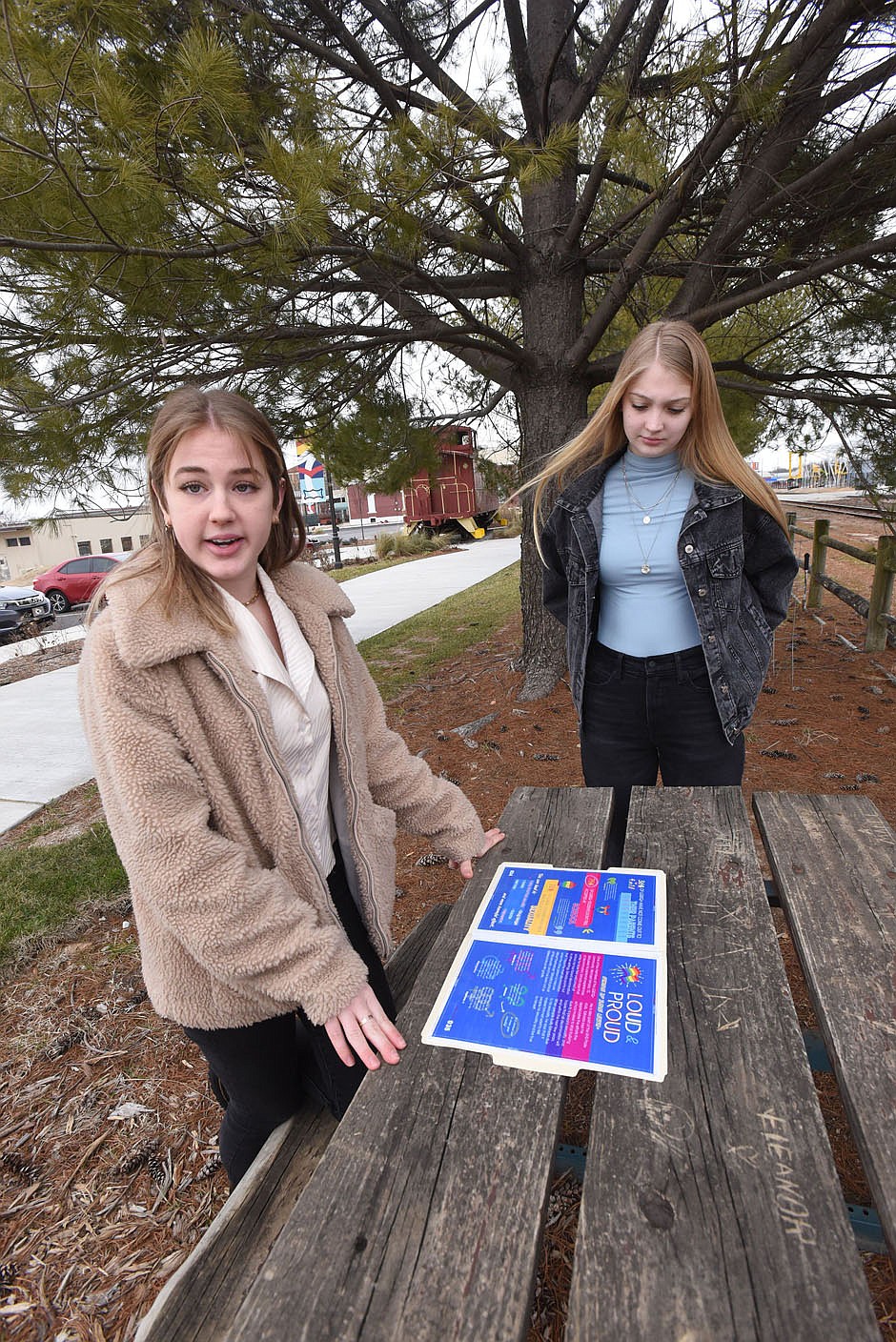 Betty Gower (left), 17, and Grace Henley, 18, talk Saturday Feb. 6 2021 in downtown Rogers about their LGBTQ Rogers High School yearbook proposal.
(NWA Democrat-Gazette/Flip Putthoff)