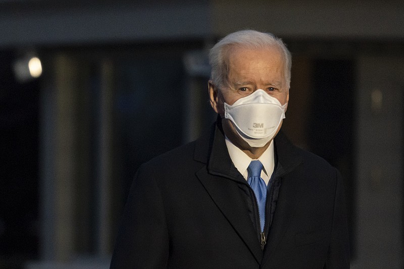 President Joe Biden pauses to speak with reporters as he walks to Marine One for departure from the South Lawn of the White House, Friday, Feb. 12, 2021, in Washington. 
(AP Photo/Alex Brandon)