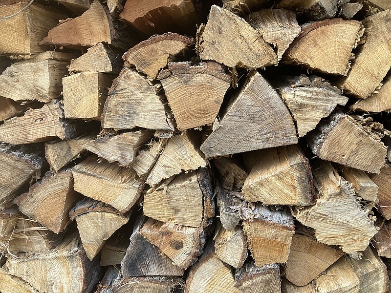 A neatly stacked pile of split and seasoned firewood helps warm a chilly winter.
(NWA Democrat-Gazette/Flip Putthoff)