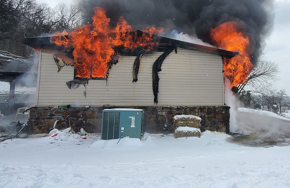 Courtesy photo/Special to the McDonald County Press Fire destroyed this home on Little Missouri Hollow on Monday afternoon. White Rock and Pineville Fire Departments responded to the blaze.