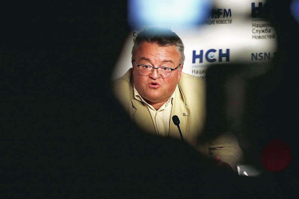 FILE - In this Sept. 4, 2020 file photo, Russian national Igor Nikulin speaks during a news conference in Moscow, Russia. Nikulin argues the U.S. created the virus and used it to attack China. Nikulin says he is a former U.N. arms inspector, but the man who would have been his boss said he's never heard of him. (AP Photo/Pavel Golovkin, File)