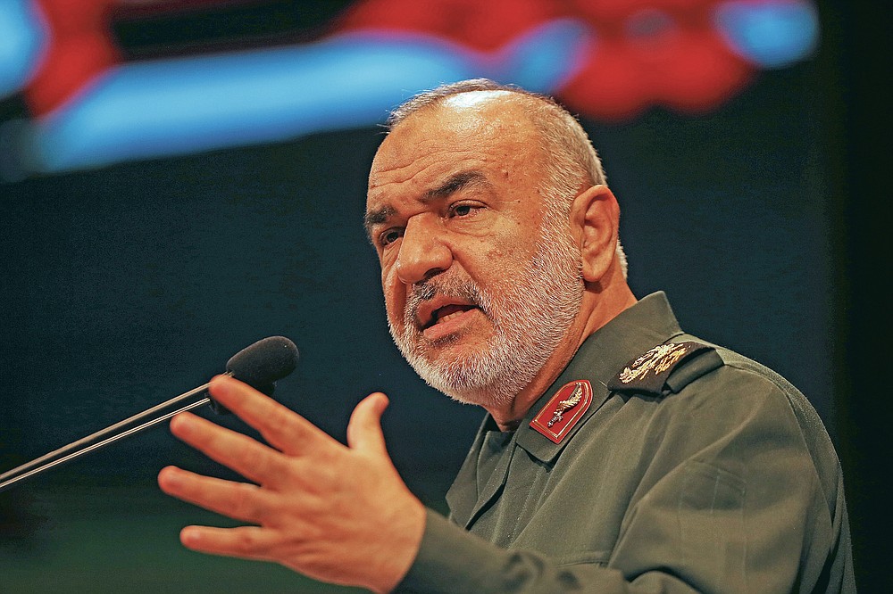 FILE - In this Nov. 22, 2018 file photo, the then-deputy commander of Iran's Revolutionary Guard Gen. Hossein Salami speaks during a conference in Tehran, Iran. Salami declared on March 5, 2020 that Iran is currently engaged in a fight against a virus which might be the product of an American biological attack. (AP Photo/Vahid Salemi, File)