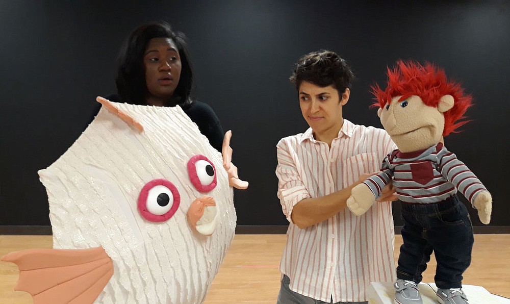 Jasmine A. Neal (left) and Jaddy Ciucci perform in “Turning Red: Learning to Choose Love,” a Trike Theatre orginal play, in April 2019. The theater group will hold an online watch party of the production at 3 p.m. April 21.
(Courtesy Photo)