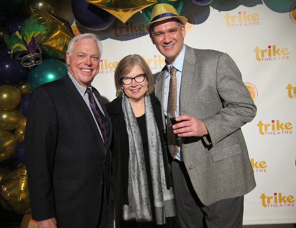 NWA Democrat-Gazette/CARIN SCHOPPMEYER Bill and Mildred Rogers (from left) and Paul Savas, Trike Theatre executive director, welcome guests to Laughter and Libations on March 1 at Record in Bentonville.