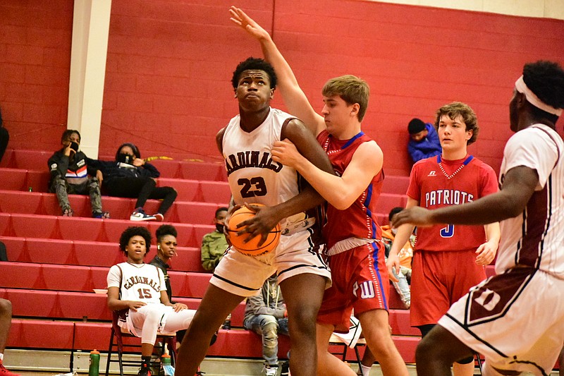 Dollarway forward Mario Benjamin (23) penetrates for a short-range basket against Palestine-Wheatley on Tuesday, Jan. 26, at Dollarway Fieldhouse. (Pine Bluff Commercial/I.C. Murrell)