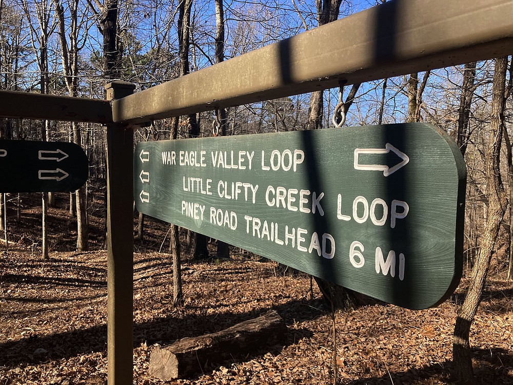 Signs at trail intersections help hikers, mountain bikes and horeseback riders follow the War Eagle Valley Loop.
(NWA Democrat-Gazette/Flip Putthoff)