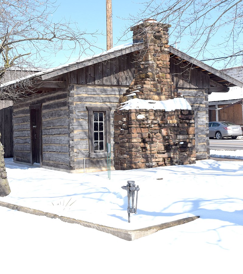 Westside Eagle Observer/MIKE ECKELS

The day after Winter Storm Viola dropped from five to eight inches of snow over Northwest Arkansas Feb. 18, the skies cleared revealing a picture perfect winter scene with the log cabin in Decatur serving as a backdrop.