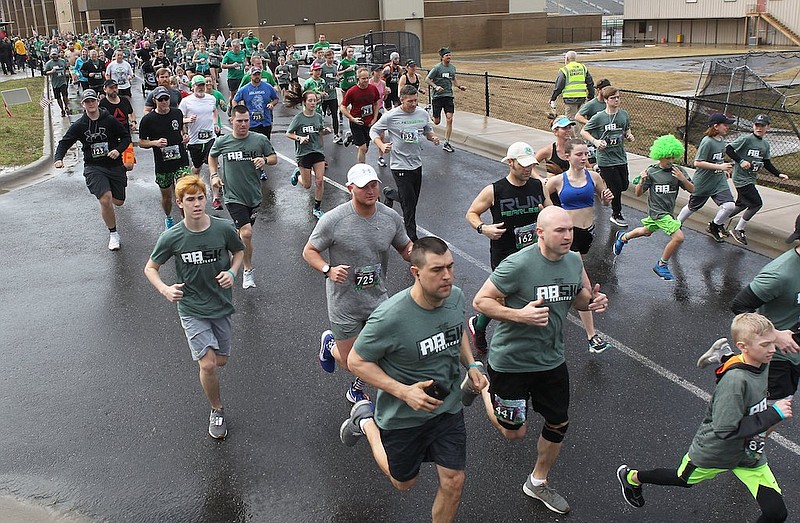Runners take off at the start of the Adam Brown Shamrock Run on March 9, 2019, at Lake Hamilton School. - Photo by Richard Rasmussen of The Sentinel-Record