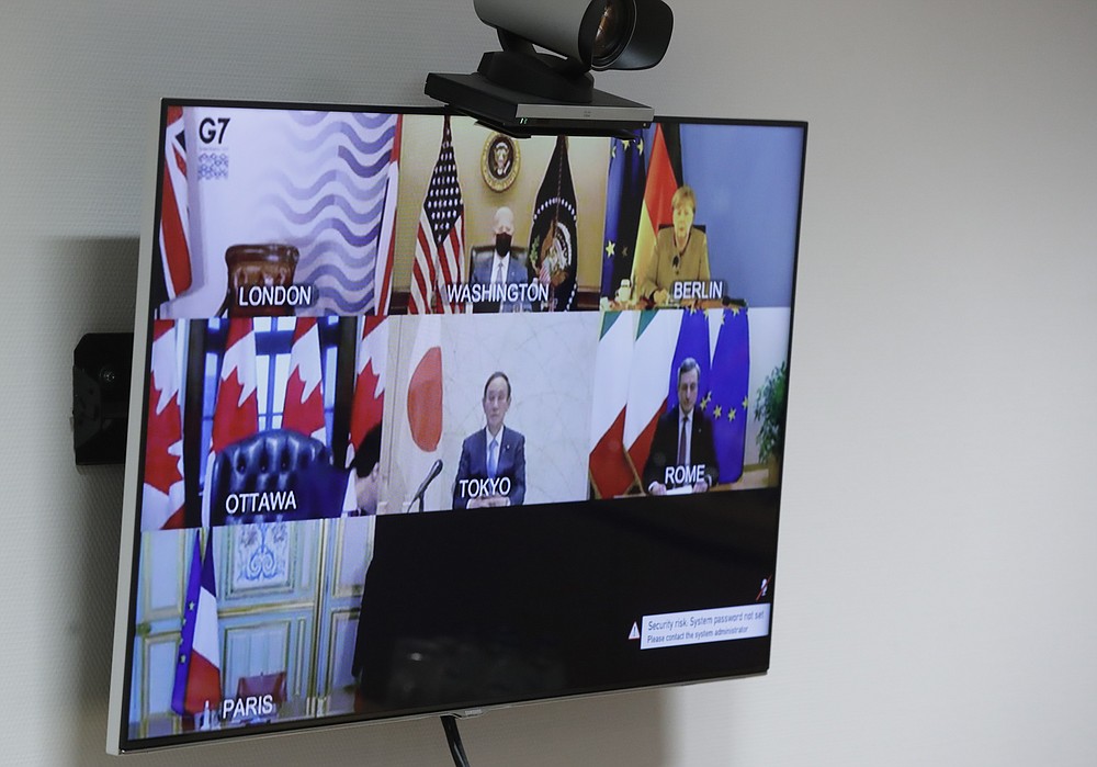 A general view of the video screen of G7 leaders as European Commission President Ursula von der Leyen and European Council President Charles Michel prepare to take part online at the European Council building in Brussels, Friday, Feb. 19, 2021. (Olivier Hoslet, Pool via AP)