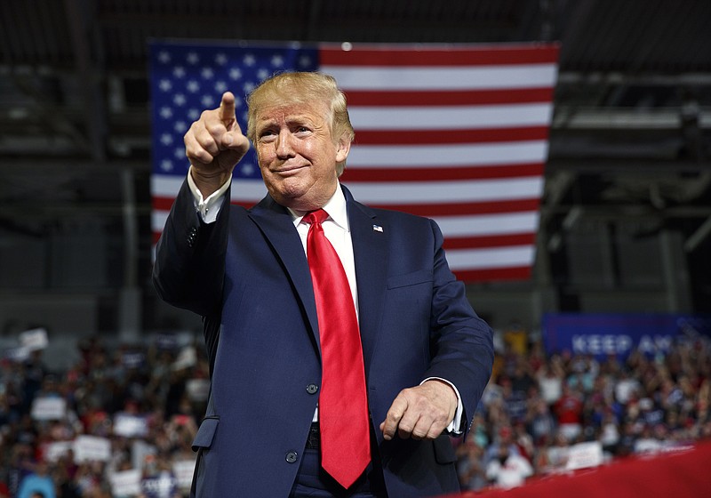 FILE - In this Wednesday, July 17, 2019 file photo, President Donald Trump gestures to the crowd as he arrives to speak at a campaign rally at Williams Arena in Greenville, N.C. (AP Photo/Carolyn Kaster, File)